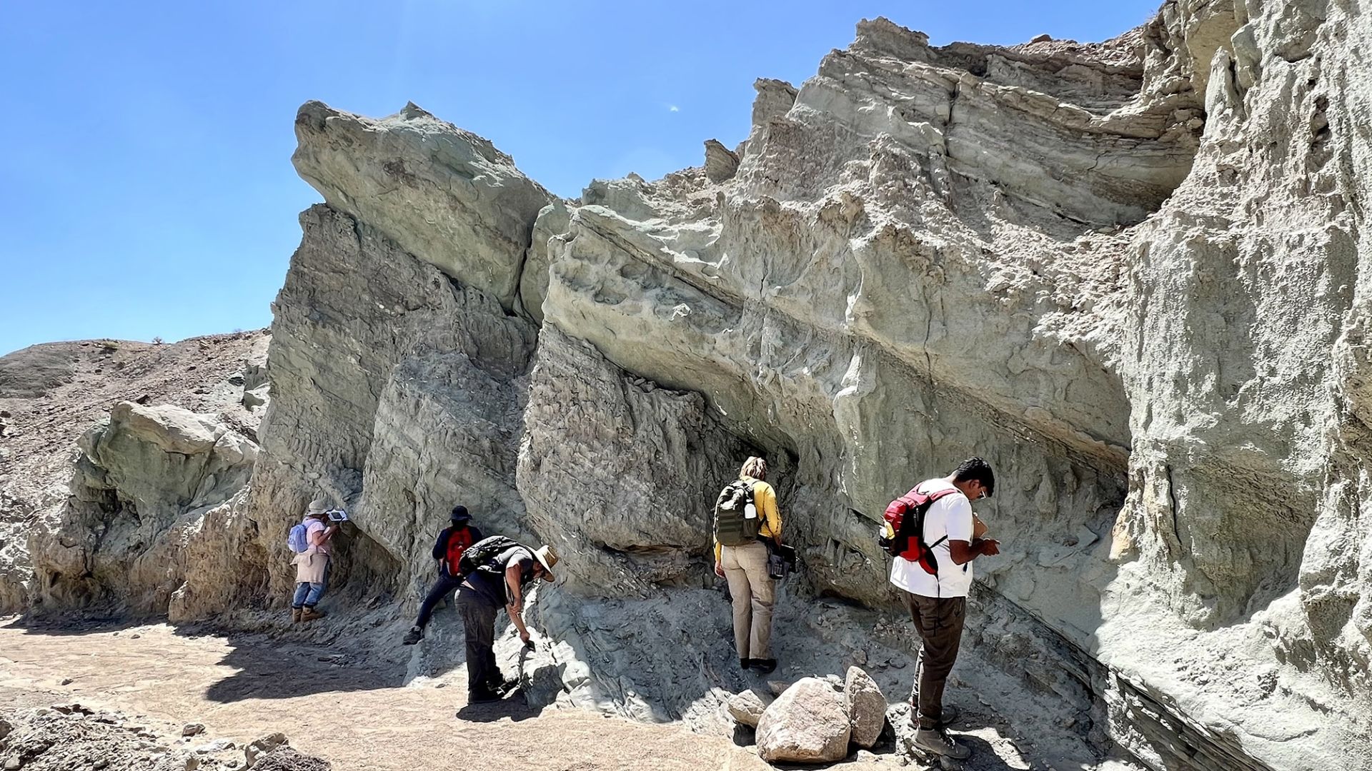 Geological sciences students studying rock formations